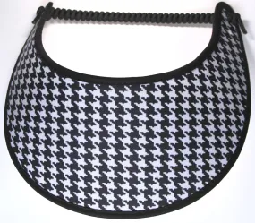This ladies’ sun visor features a black and white houndstooth design with black trim.