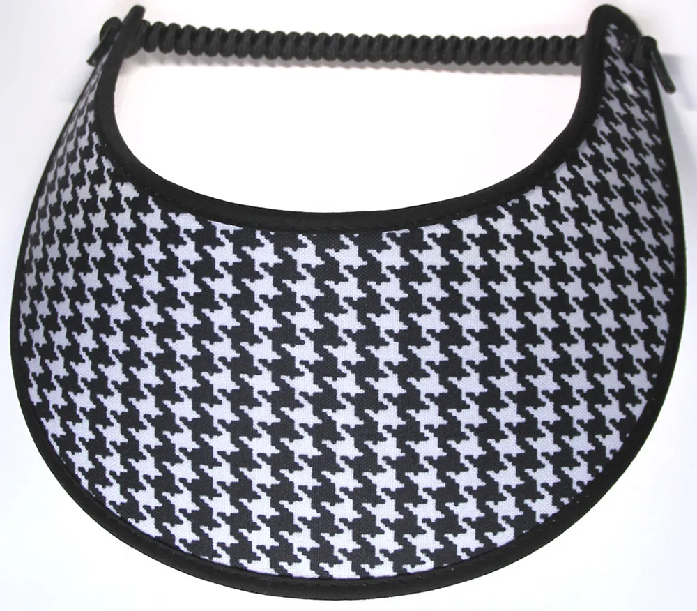 This ladies’ sun visor features a black and white houndstooth design with black trim.